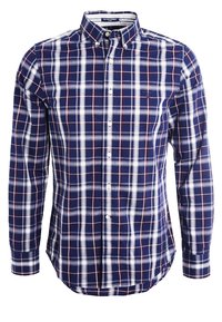 Koszula w kolorach granatowym, białym i czerwonym w kratę, z długim rękawem i kołnierzykiem na guziki. Wykonana z bawełny, z zaokrąglonym dołem i haftowanym logo na piersi.