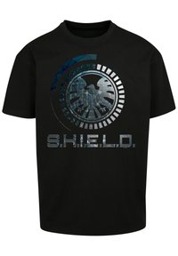 Svart bomull t-skjorte med et rundt emblem som viser en ørn og "S.H.I.E.L.D." i stilisert, metallisk skrift.