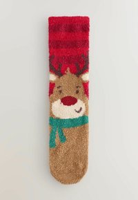 Pūkains sarkans, brūns un krējuma krāsas socks ar dienvidu ziemeļbrieda seju, ragiem, sarkanu degunu un zaļu šalli. Visā virsmā ir teksturēts, mīksts materiāls.