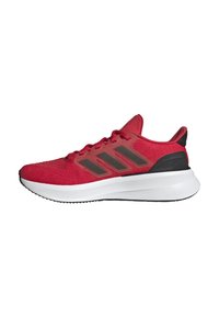Zapatillas deportivas rojas con una parte superior de tejido texturizado, detalles en negro y tres rayas gris oscuro. Mediasuela blanca y suela de goma.