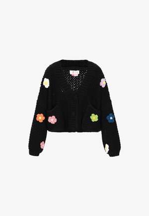 Cardigan court en tricot noir avec de gros boutons et des appliqués de fleurs en crochet colorées sur les manches et le devant.