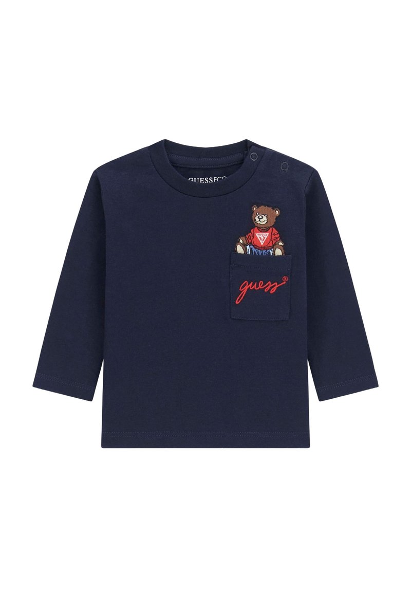 Navyblaues Langarmshirt aus Baumwolle mit rundem Ausschnitt, das eine Bärenstickerei auf der Tasche und ein rotes "guess"-Textdetail aufweist.