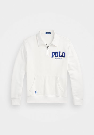Balts frotēts džemperis ar puscirkni un apkakli. Iezīmēts ar izteiksmīgu zilu "POLO" logotipu un kangaroo kabatu, ar mazu zilu zirga emblēmu.