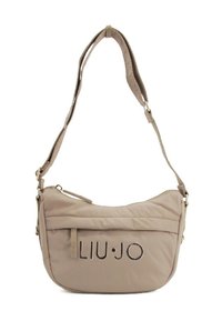 Borsa a spalla in nylon beige con forma curva. Caratterizzata da un comparto con zip, logo in rilievo e una tracolla regolabile. Texture liscia.