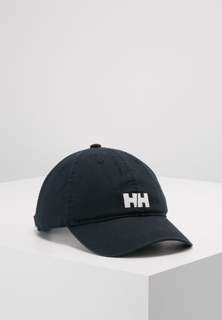 Marineblauwe baseballpet gemaakt van stof, met een geborduurd wit "HH" logo op de voorkant en een gebogen klep. Geen extra accenten.