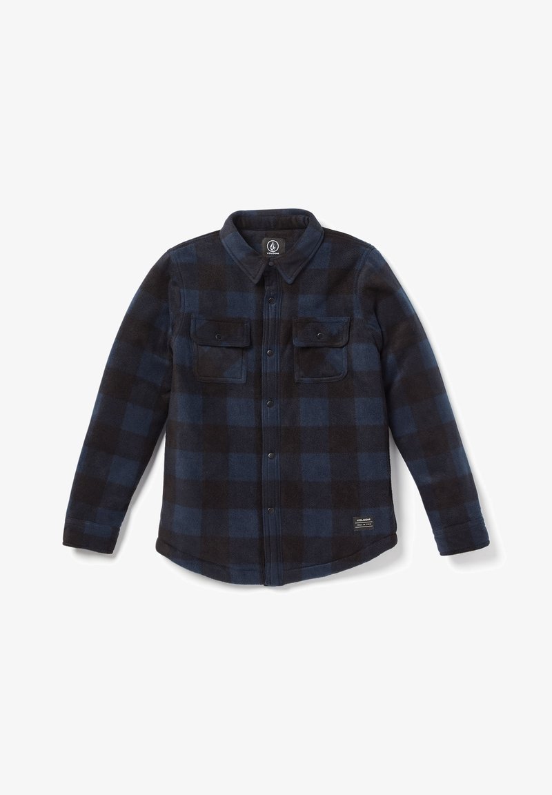 Chemise à manches longues à carreaux noirs et bleu foncé, avec deux poches poitrine avant et une petite étiquette logo sur l'ourlet inférieur.