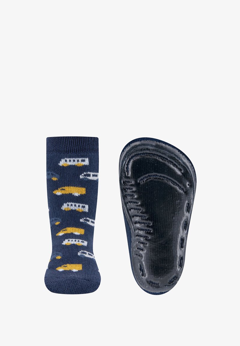 Blue patterned sock with a textured black rubber sole, featuring yellow and white designs on a navy background; ribbed top edge.