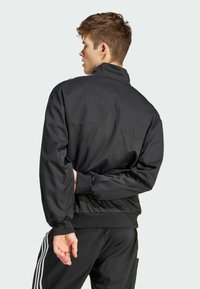 adidas Sportswear MATERIAL MIX TRACK - Trainingsjacke - black
