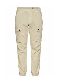 Beige Cargo-Hosen mit elastischem Bund, zwei seitlichen Taschen und schmal zulaufendem Bein. Aus leichtem Stoff gefertigt, mit schwarzen Druckknopf-Details.
