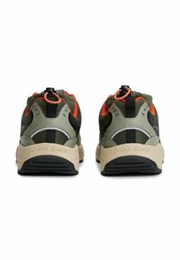 Green and black sneakers with a textured mesh upper, orange accents, and a rubber sole; features a toggle closure on the heel.