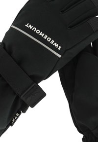 Schwarze Handschuhe mit strukturierter Grifffläche, ausgestattet mit einem silbernen reflektierenden Streifen und Klettverschluss. Der Markenname ist oben sichtbar.