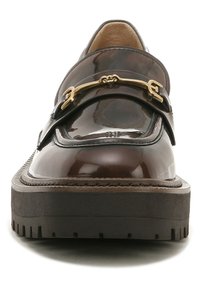 Brown patent leather loafer with gold hardware, thick black platform sole, and contrasting stitching detail along the edge.