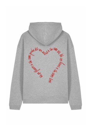 Sweat à capuche gris avec un design textuel rouge circulaire au dos, mettant en avant une forme de cœur et un message positif. Texture douce, style décontracté.