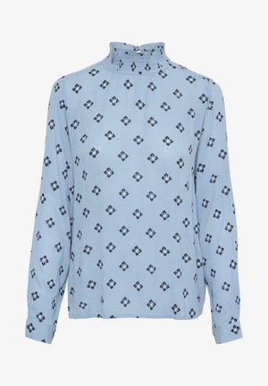 Błękitna bluzka z długim rękawem z wysokim wykończeniem w formie marszczenia, w którego wzorze znajdują się diamenty w kolorze granatowym. Wykonana z miękkiego, teksturowanego materiału.