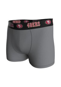 Harmaat bokserialushousut, joissa on musta joustava vyötärönauha, jossa lukee "49ERS" ja logo punaisena ja kultaisena. Sileä pinta ja istuva muotoilu.