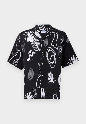 Short-sleeve shirt in black fabric featuring bold white abstract patterns, button front, and relaxed fit. Suitable for casual wear.