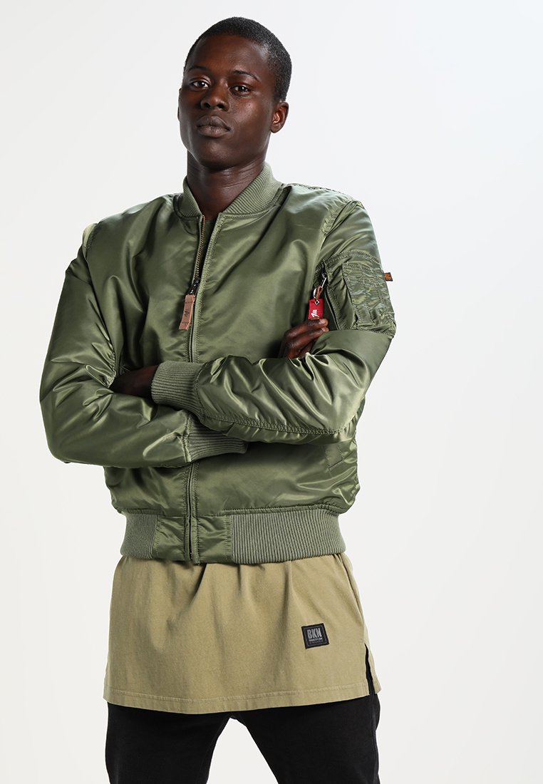 Olive green bomber jacket with zipper, ribbed cuffs, and hem. Features a utility pocket on the sleeve and smooth, shiny fabric texture.