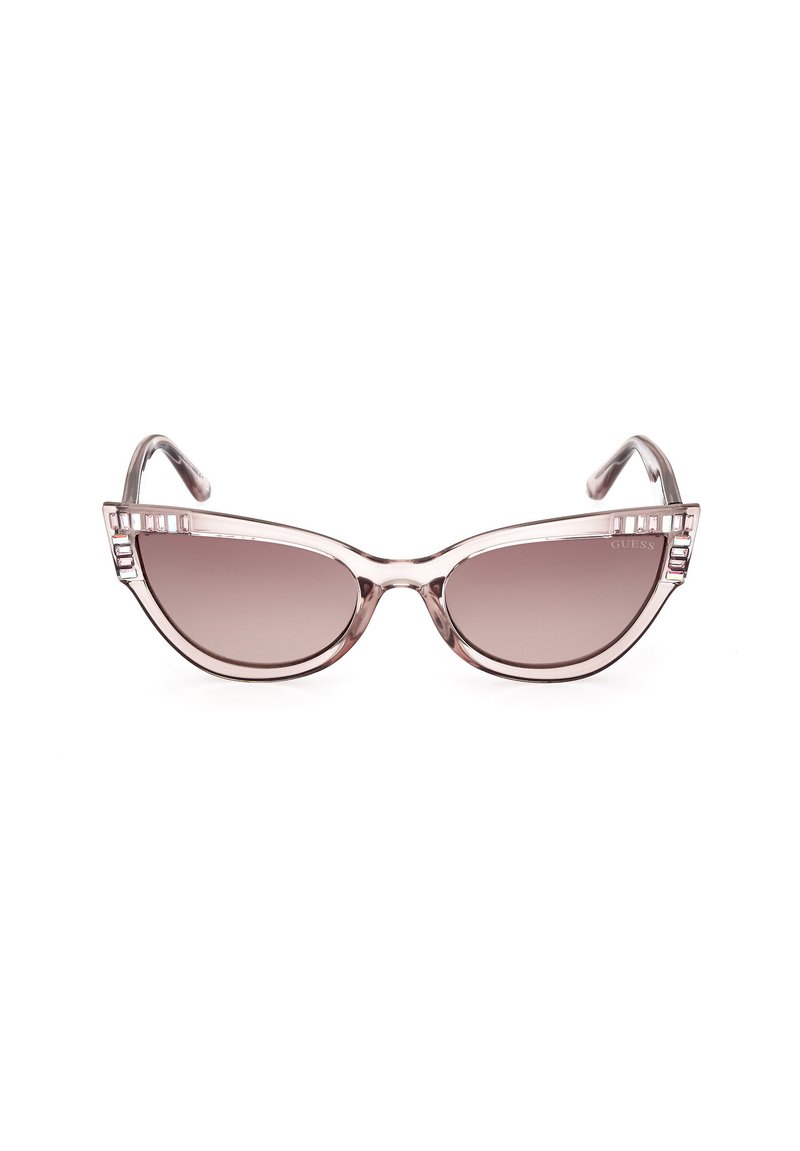Transparente rosa Katzenaugen-Sonnenbrille mit einem Farbverlauf in braunem Glas und dekorativen rechteckigen Akzenten in der Nähe der Scharniere.