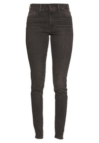 Zwarte high-waisted skinny jeans van denim, met vijf zakken, een ritsgulp en een subtiele vervaagde textuur.