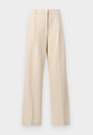 Bēša augsta vidukļa platām kājām bikses ar priekšējiem krokām un slēptu rāvējslēdzēju lidojumu, izgatavotas no faktūras auduma.