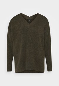 Mörk olivgrön, v-ringad tröja i mjukt tyg med avslappnad passform. Har långa ärmar och en något rundad nederkant.