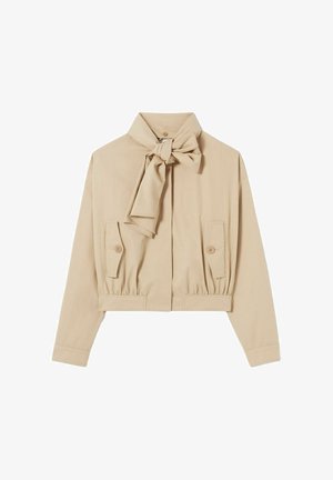 Giacca beige tagliata con collo annodato sul davanti, due tasche frontali, dettagli con bottoni e orlo elasticizzato, realizzata in tessuto liscio.