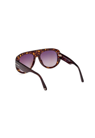Tortoiseshell sunglasses with a geometric oversized frame and gradient purple lenses. Features subtly metallic accents on the arms.