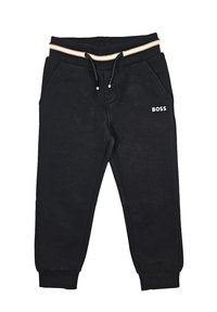 Pantaloni sportivi neri realizzati in tessuto morbido, con una vita elasticizzata e un cordino beige, due tasche laterali e un logo bianco sulla gamba.