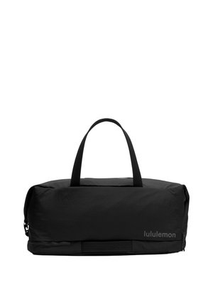 Bolsa de gimnasio negra y rectangular con dos asas y logo "lululemon" en el lado frontal.