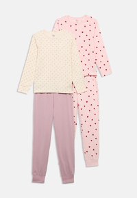 Set of two pajama tops: one cream with floral print, one pink with red hearts; paired with pink and purple pants, soft cotton fabric.