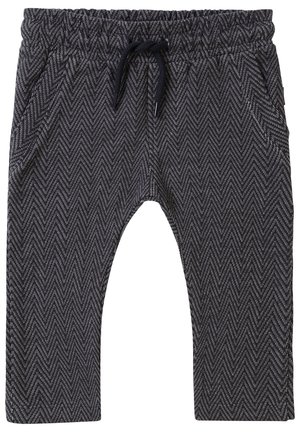 Schwarz-weiß gemusterte Chevron-Hose mit elastischem Bund und schwarzem Kordelzug, seitlichen Taschen und entspannter Passform.