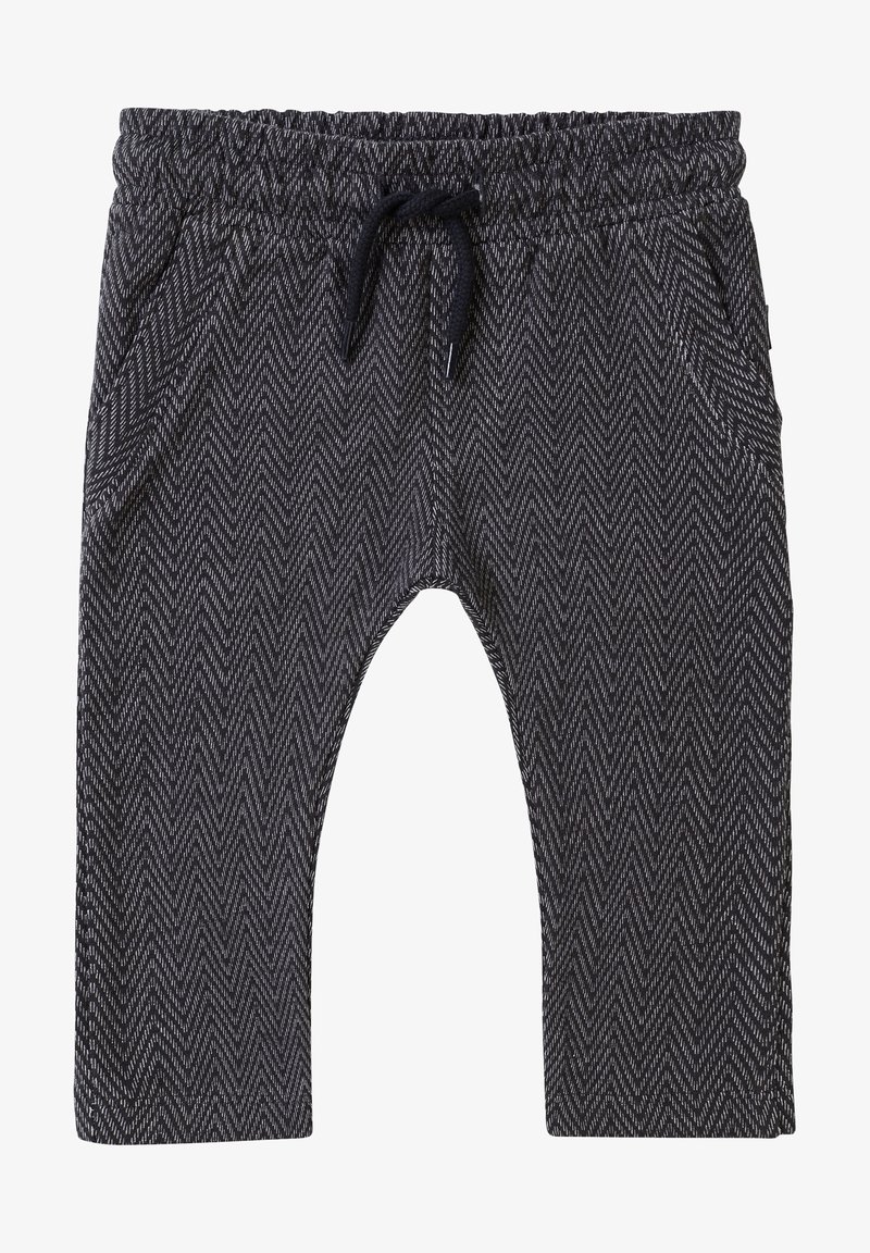 Pantalon à motif chevron noir et blanc avec taille élastique et cordon noir, avec poches latérales et coupe décontractée.