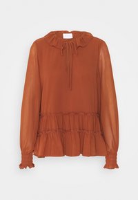 Rostfärgad blus med volangkrage, långa genomskinliga ärmar och tiered peplum nederkant. Texturerad tyg med snörning vid halsen.