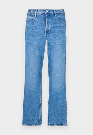 Blå, rette jeans laget av denim med en falmet vask. Har knapppakning, beltehemper og standard fem-lommers design.