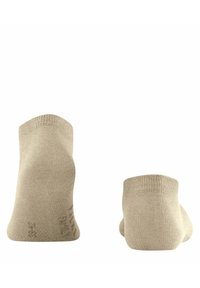Beżowe skarpetki do kostek o gładkiej fakturze, z prążkowanym ściągaczem i subtelnym logo z boku. Minimalistyczny design, idealne do codziennego użytku.