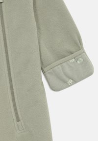 Lindex OVERALL WIND UNISEX - Combinaison - light dusty green