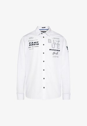 White long-sleeve shirt with a button-up front, featuring black and gray printed text, black buttons, and a classic collar design.