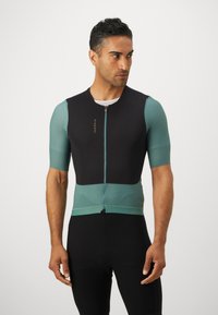 Kortärmad cykeltröja med svart kropp, akvamarin-meshdetaljer och dragkedja fram. Har lätt och andningsbart tyg samt en kroppsnära design.