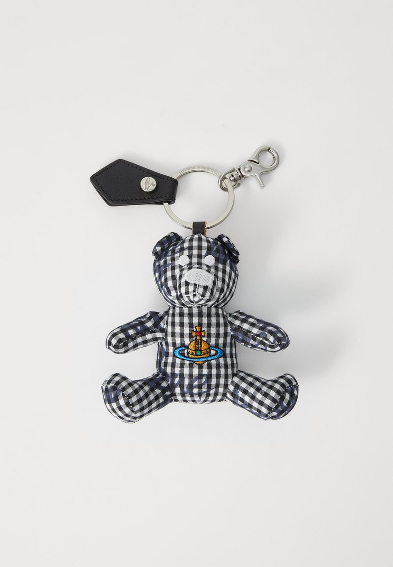 Black and white checkered teddy bear keychain with embroidered design featuring a yellow submarine on a blue circle and silver hardware.