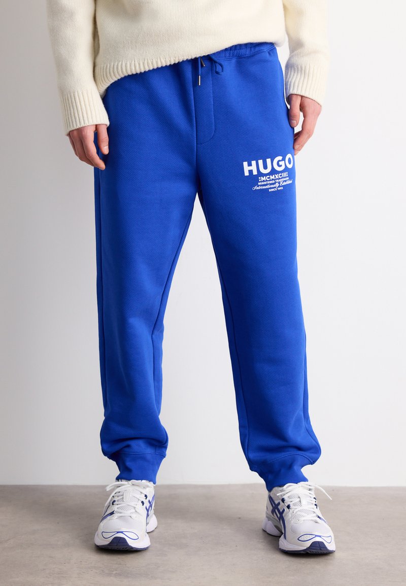 HUGO NEVEZ Tracksuit Bottoms Open Blue blue Zalando ie hugo-nevez-tracksuit-bottoms-open-blue-blue-zalando-ie