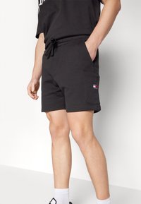 Tommy Jeans BADGE CARGO  - Tracksuit bottoms - black