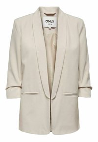 Blazer beige con apertura frontale, collo sciallato, maniche a tre quarti e due tasche frontali. Realizzato in tessuto leggero e morbido.