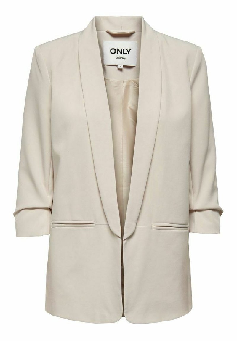 Blazer beige con apertura frontale, collo sciallato, maniche a tre quarti e due tasche frontali. Realizzato in tessuto leggero e morbido.