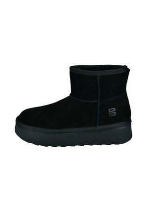 Black suede ankle boot with a rounded toe, padded collar, and a textured rubber sole. Features a subtle logo on the side.
