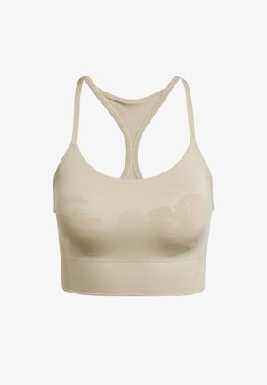 Beige urheilusukkanen, jossa on racerback-muotoilu, ribbed-rakenne ja saumaton rakenne. Kangasta koristaa hienovarainen sävykuvio.