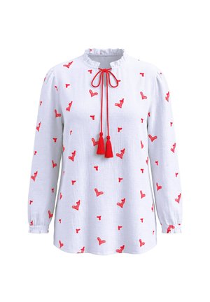 Weiße Langarmbluse mit roten, bestickten Herzmustern, gerafftem Kragen und roten Quastenbändern am Ausschnitt.