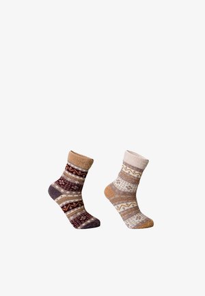 Two pairs of patterned socks in shades of brown and cream. One has a textured cuff; both feature geometric designs and soft textures.