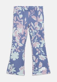 Leggings svasati in un tessuto blu con un motivo floreale in rosa e menta. Vita elastica e logo Nike bianco sulla gamba.