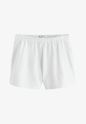 Pantaloni scurți albi cu talie elastică, buzunare laterale și material neted, cu eticheta „NEXT” pe partea interioară a taliei.
