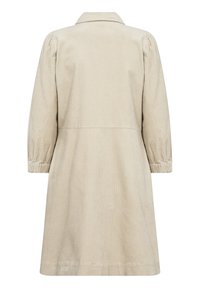 Robe en velours côtelé beige avec manches longues bouffantes, poignets élastiques, col et couture à la taille, vue de dos.